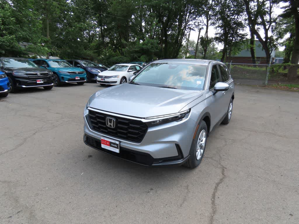 2026 Honda CR-V LX in Solar Silver Metallic — front three-quarter view