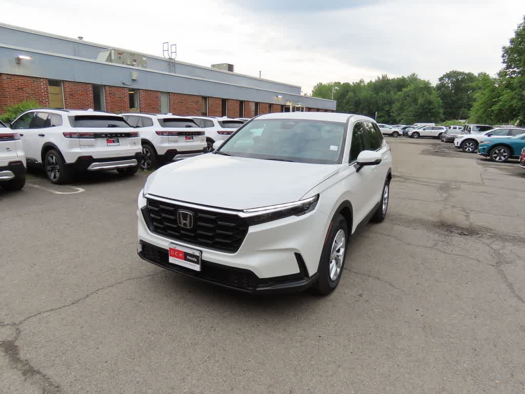2026 Honda CR-V LX in Platinum White Pearl — front three-quarter view